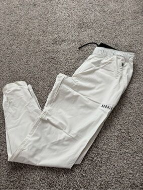 NOBULL White Track Joggers with Black Waistband Trim and zipper ankle sz S